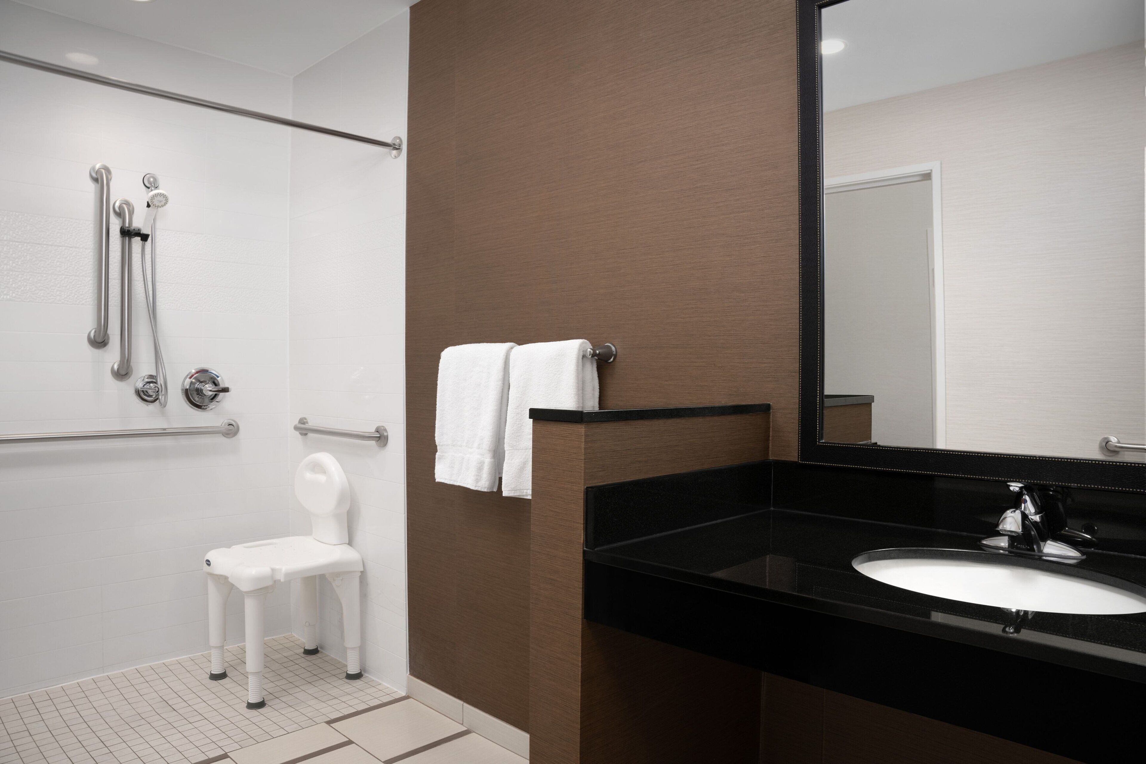 room, 1 king bed (mobility/hearing access, roll-in shwr) | bathroom | hair dryer, towels