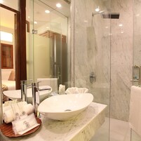 Shower, rainfall showerhead, designer toiletries, hair dryer