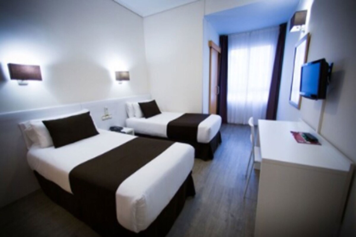 Desk, blackout drapes, WiFi (free), bed sheets