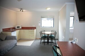 Executive Apartment, 1 Bedroom, Jetted Tub (Queen) | Living area | 32-inch flat-screen TV with digital channels, TV, DVD player