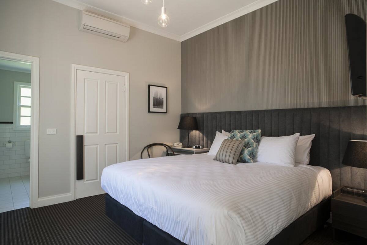 Premium bedding, desk, blackout drapes, iron/ironing board
