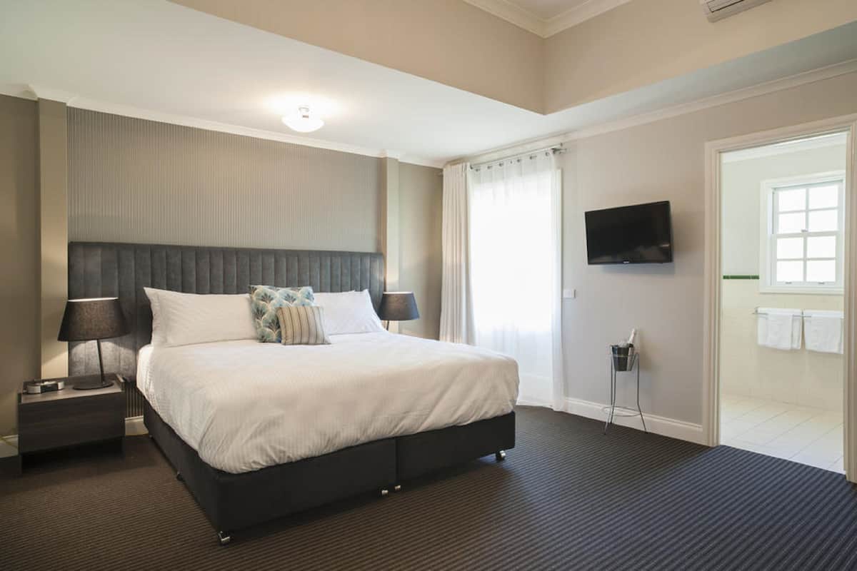 Premium bedding, desk, blackout drapes, iron/ironing board
