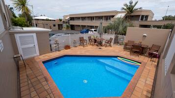 Seasonal outdoor pool, open 8:00 AM to 8:00 PM, pool loungers