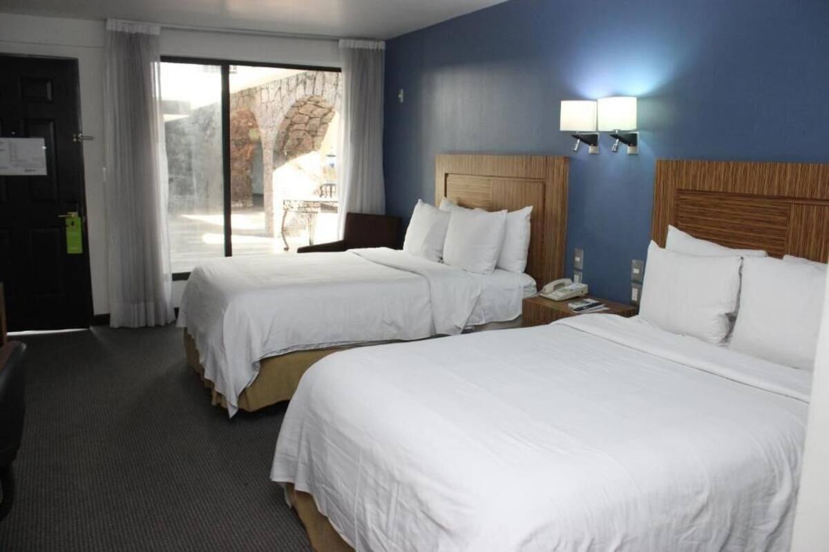 Hypo-allergenic bedding available, in-room safe, desk, laptop workspace