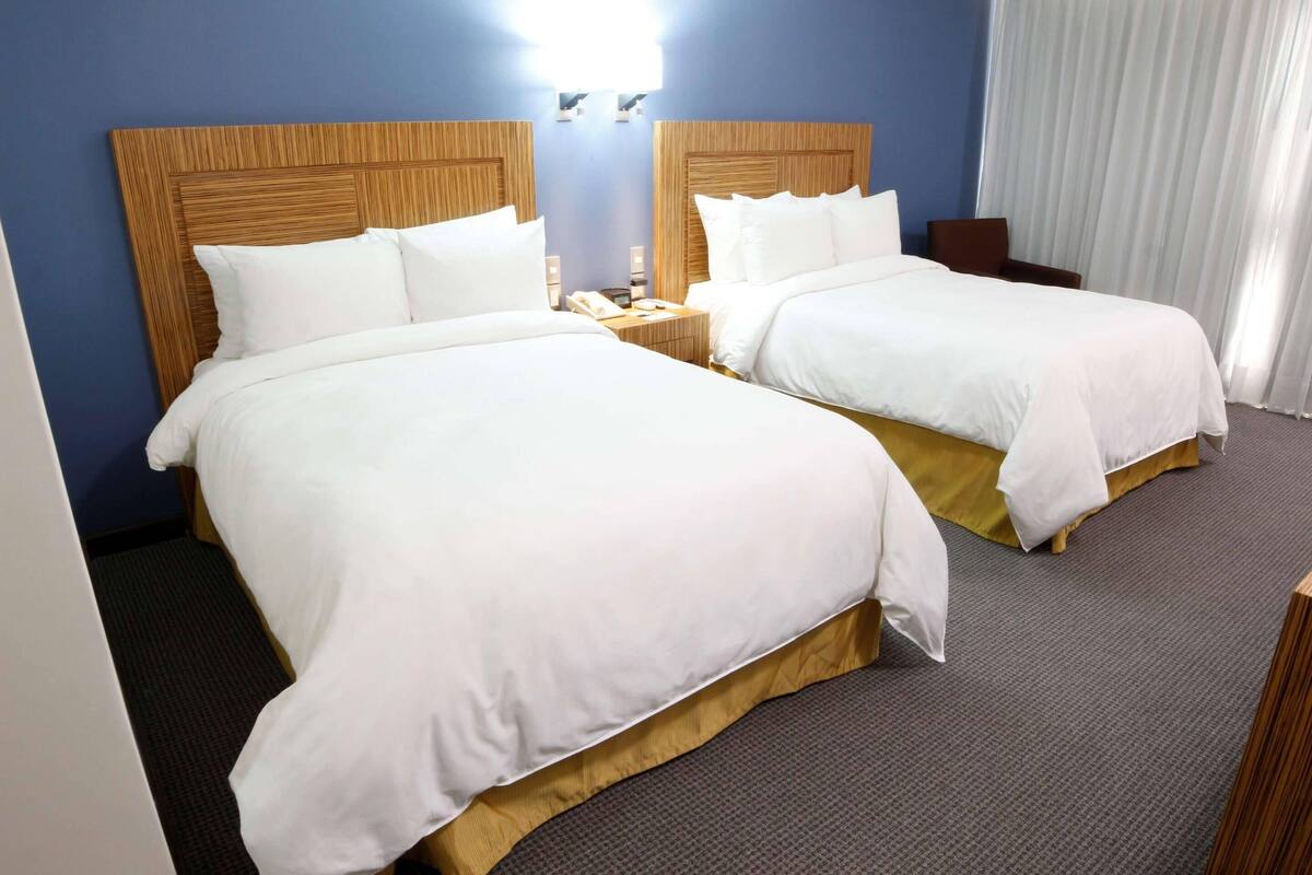 Executive Room with Two Double Beds | Hypo-allergenic bedding available, in-room safe, desk, laptop workspace
