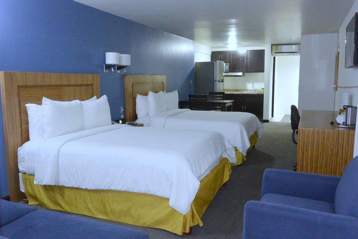 Extended Stay Room with Two Double Beds and Kitchenette | Hypo-allergenic bedding available, in-room safe, desk, laptop workspace