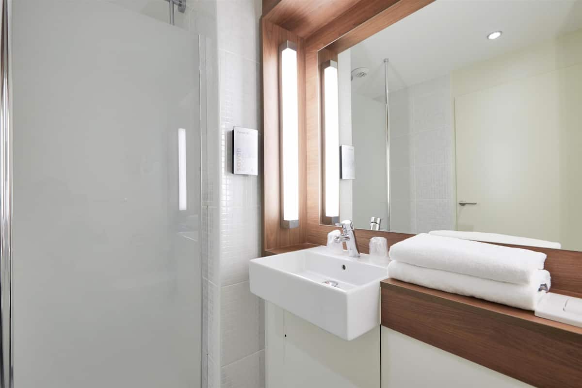 eco-friendly toiletries, hair dryer, towels