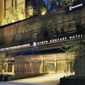 A hotel entrance with a modern facade, featuring vertical slats and illuminated signage for 'Kyoto Century Hotel.' - Kyoto Century Hotel (Kyoto)
