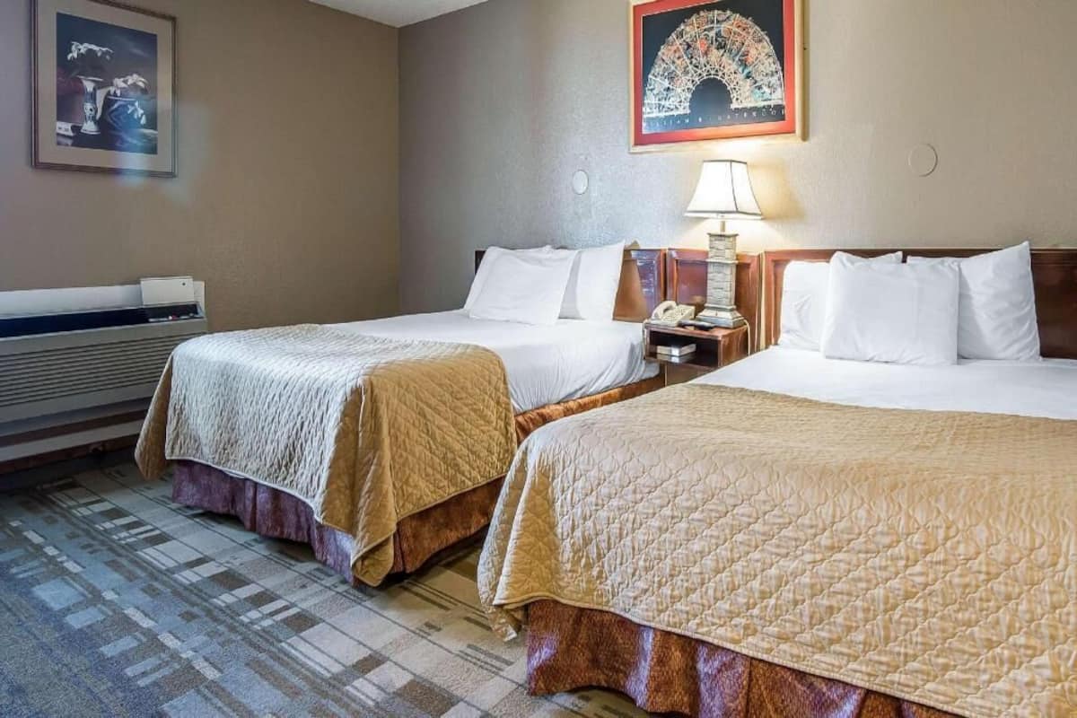 Premium bedding, desk, blackout drapes, iron/ironing board