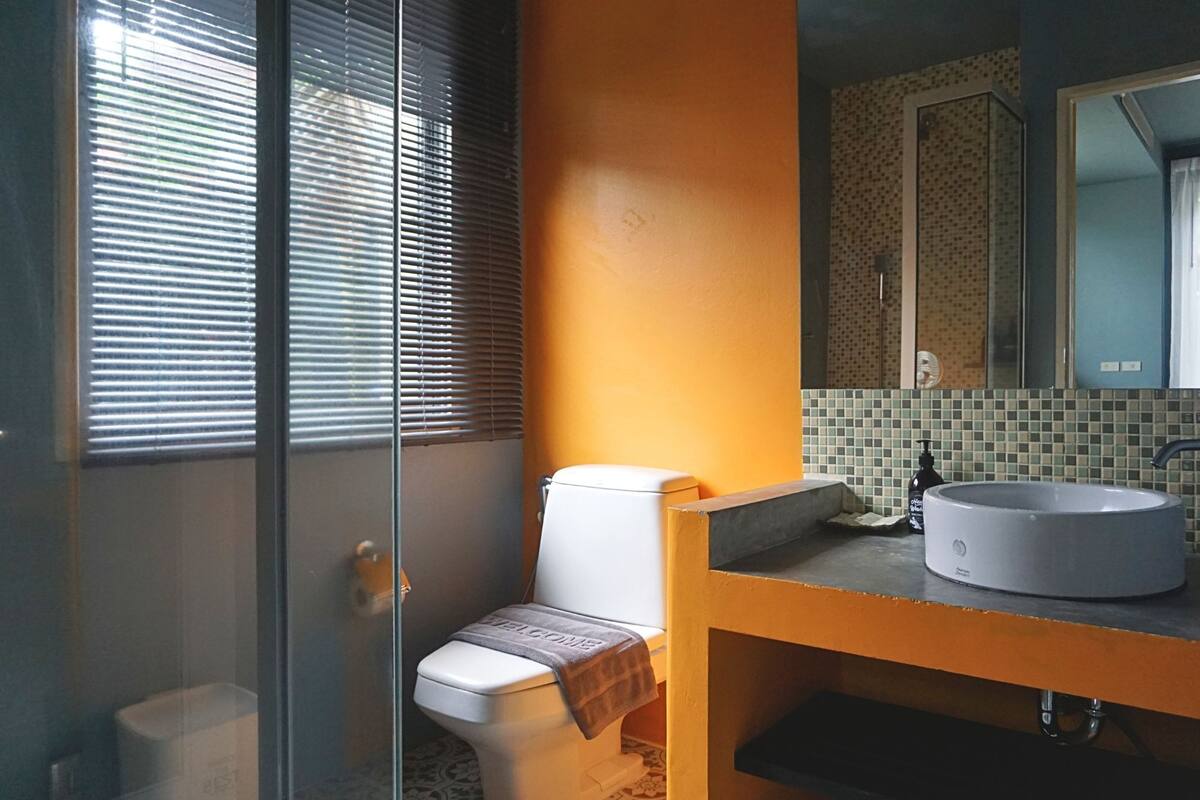 one bedroom villa pool view | bathroom | shower, free toiletries, hair dryer, towels