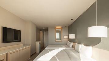 Habitación cuádruple Deluxe | Zona de estar | Televisión de pantalla plana de 42 pulgadas con canales por cable
