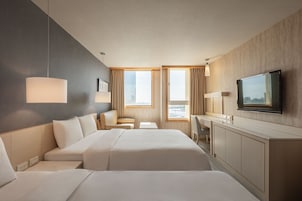 Deluxe Room, 2 Double Beds, Harbor View | Living area | 42-inch flat-screen TV with cable channels, TV, DVD player