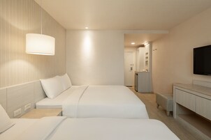 Quadruple Room, 2 Double Beds | Living area | 37-inch LED TV with cable channels, TV, DVD player