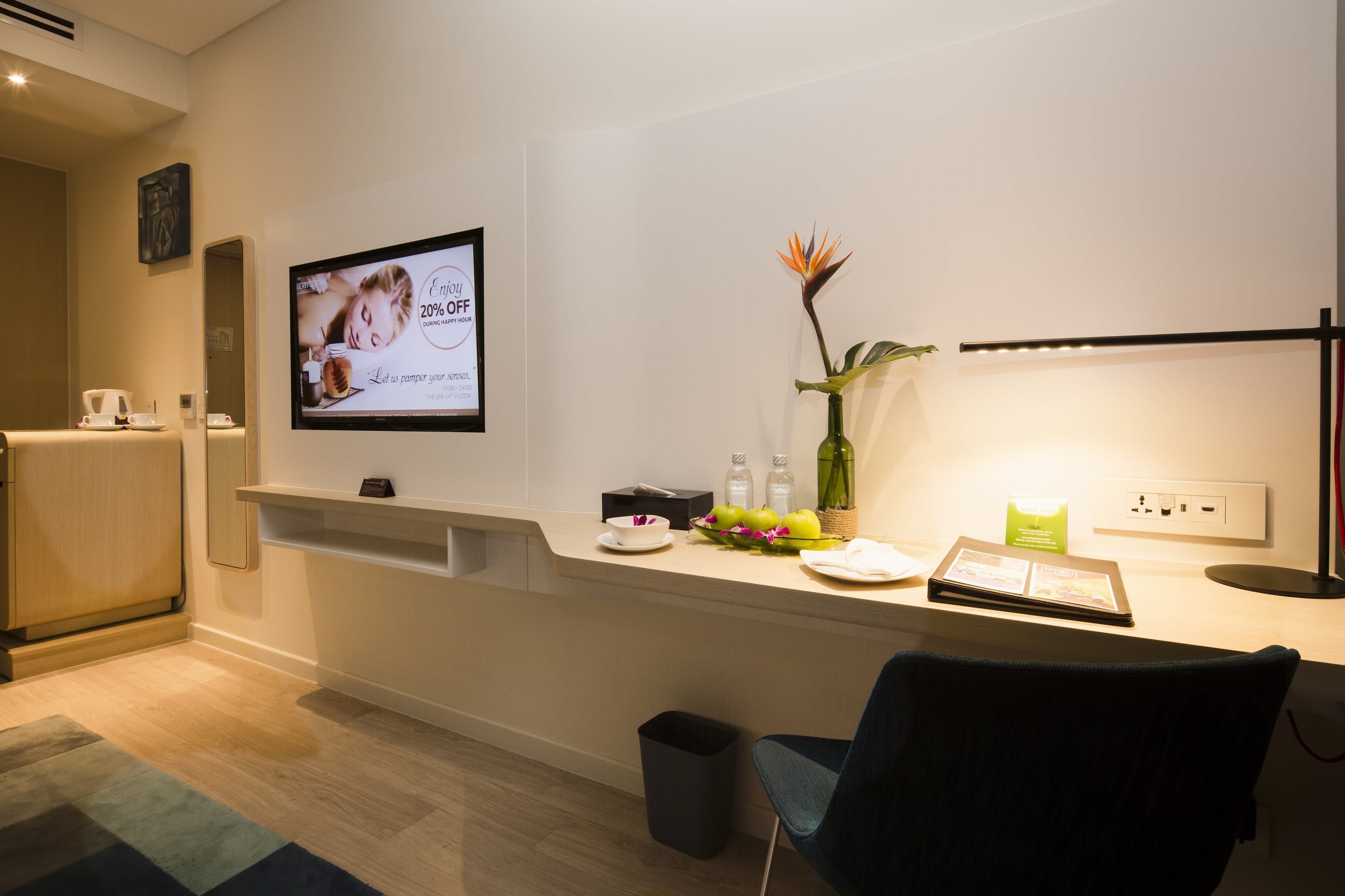 signature room, river view | minibar, in-room safe, desk, iron/ironing board