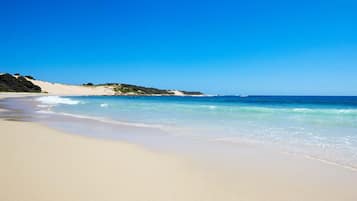 On the beach, white sand, beach towels