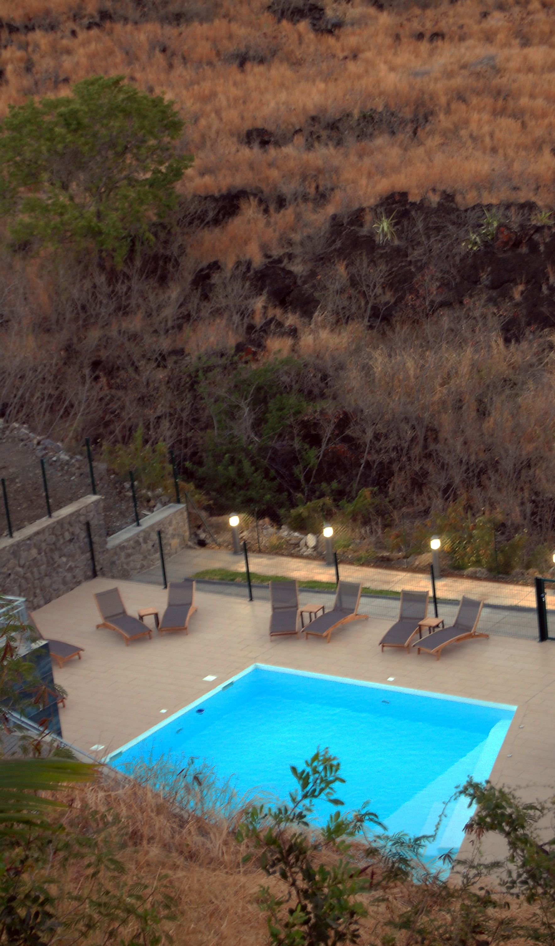 outdoor pool, open 8:00 am to 7:30 pm, pool umbrellas, pool loungers