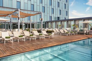 Seasonal outdoor pool, pool umbrellas, pool loungers