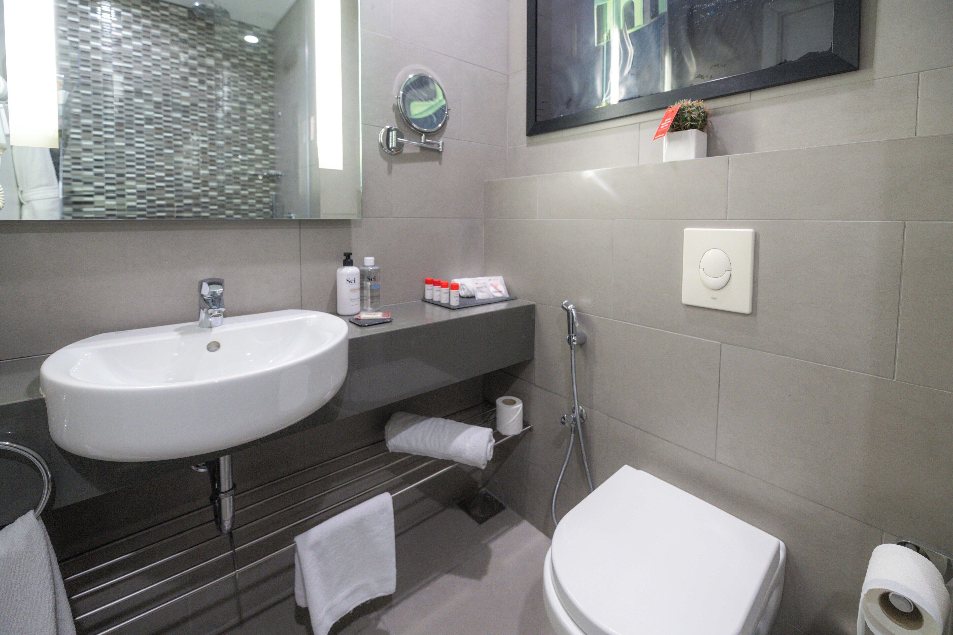 deep-soaking bathtub, free toiletries, hair dryer, bathrobes