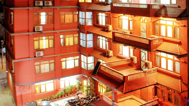 A multi-story building with balconies and air conditioning units. - Hotel Brihaspati (Kathmandu)