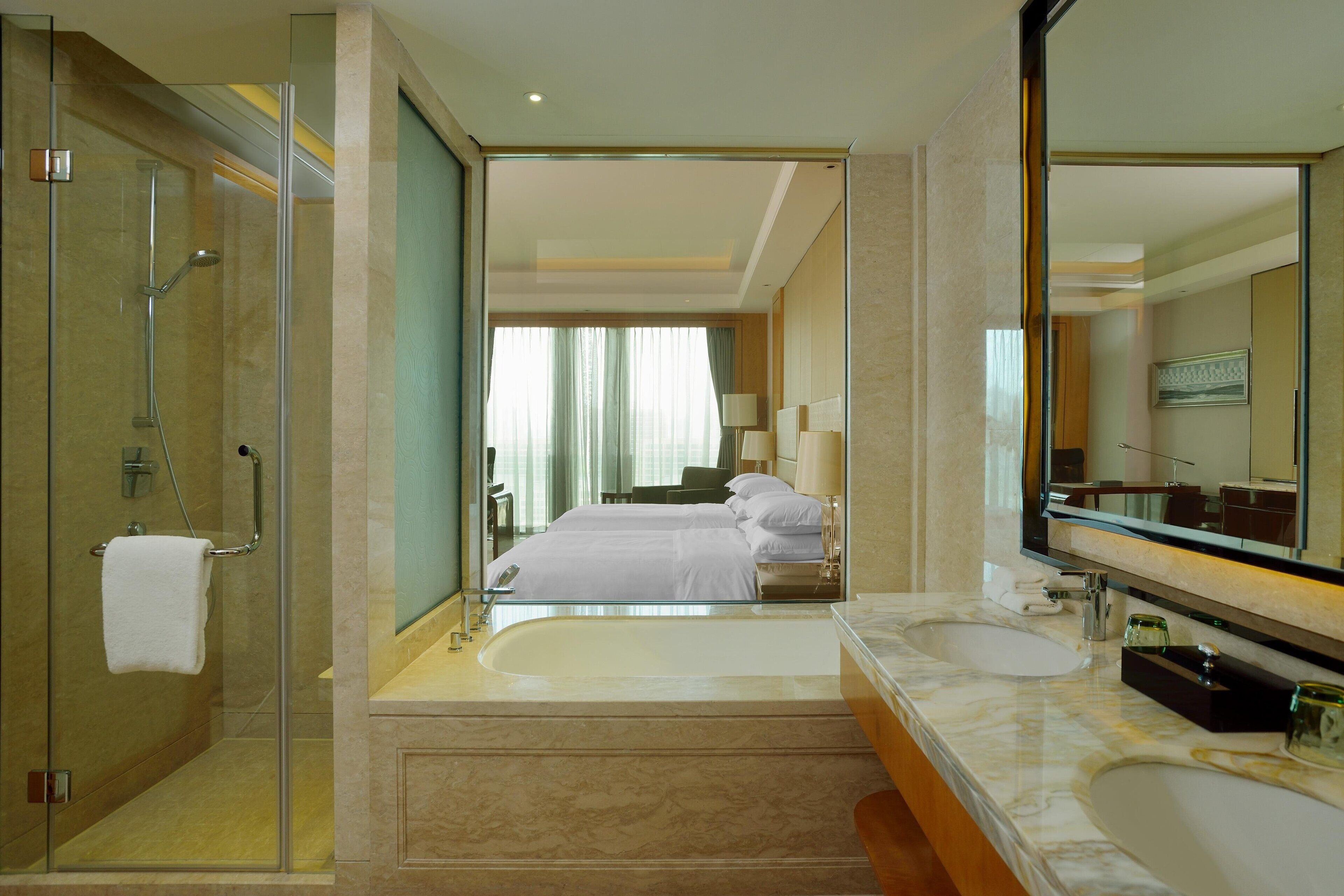 deluxe room, 2 double beds | bathroom | separate bathtub and shower, slippers, towels