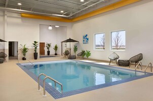 Indoor pool, open 9:00 AM to 10:00 PM, sun loungers