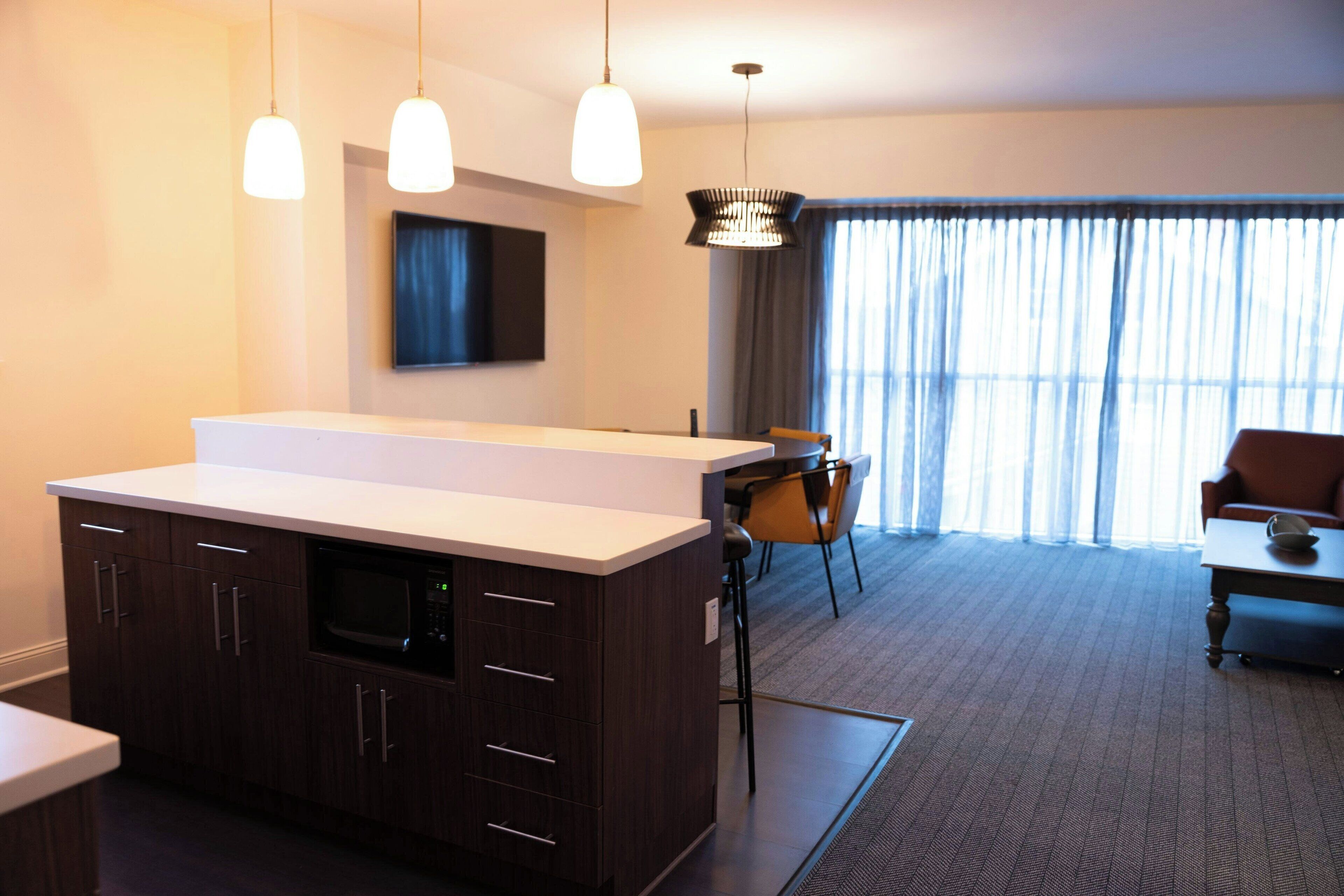 Desk, laptop workspace, blackout drapes, iron/ironing board