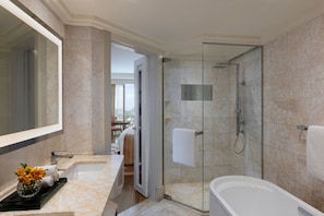 Separate tub and shower, rainfall showerhead, designer toiletries - The Ritz-Carlton, Bangalore (Bengaluru)