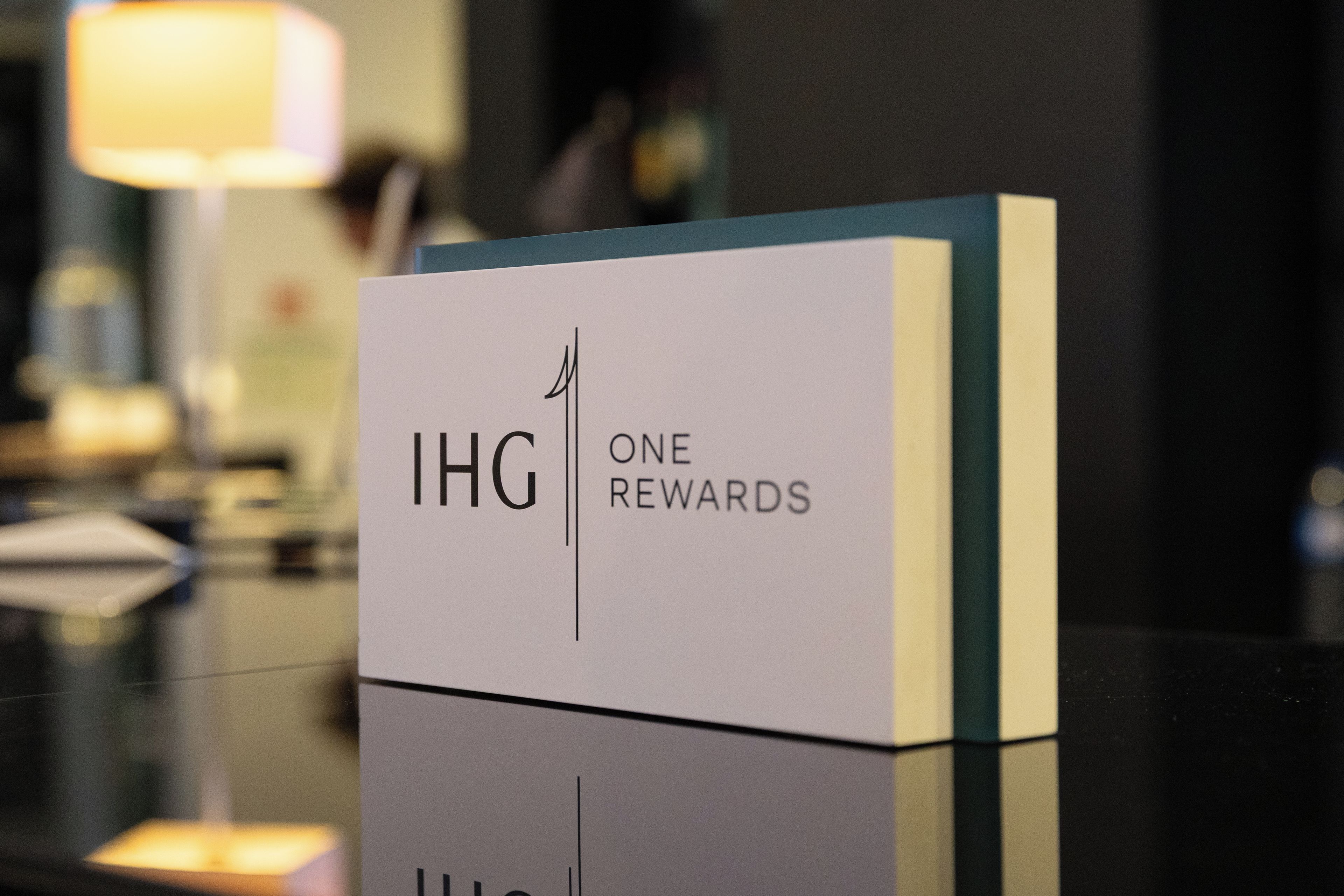 A reception desk with a sign that reads 'IHG ONE REWARDS'.