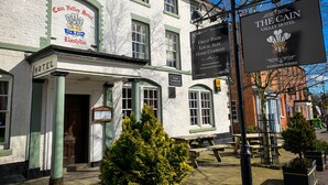 The exterior of the Cain Valley Hotel with signage for "Great Food Local Ale Good Company" and "Tanners Wines." - Cain Valley Hotel (Llanfyllin)