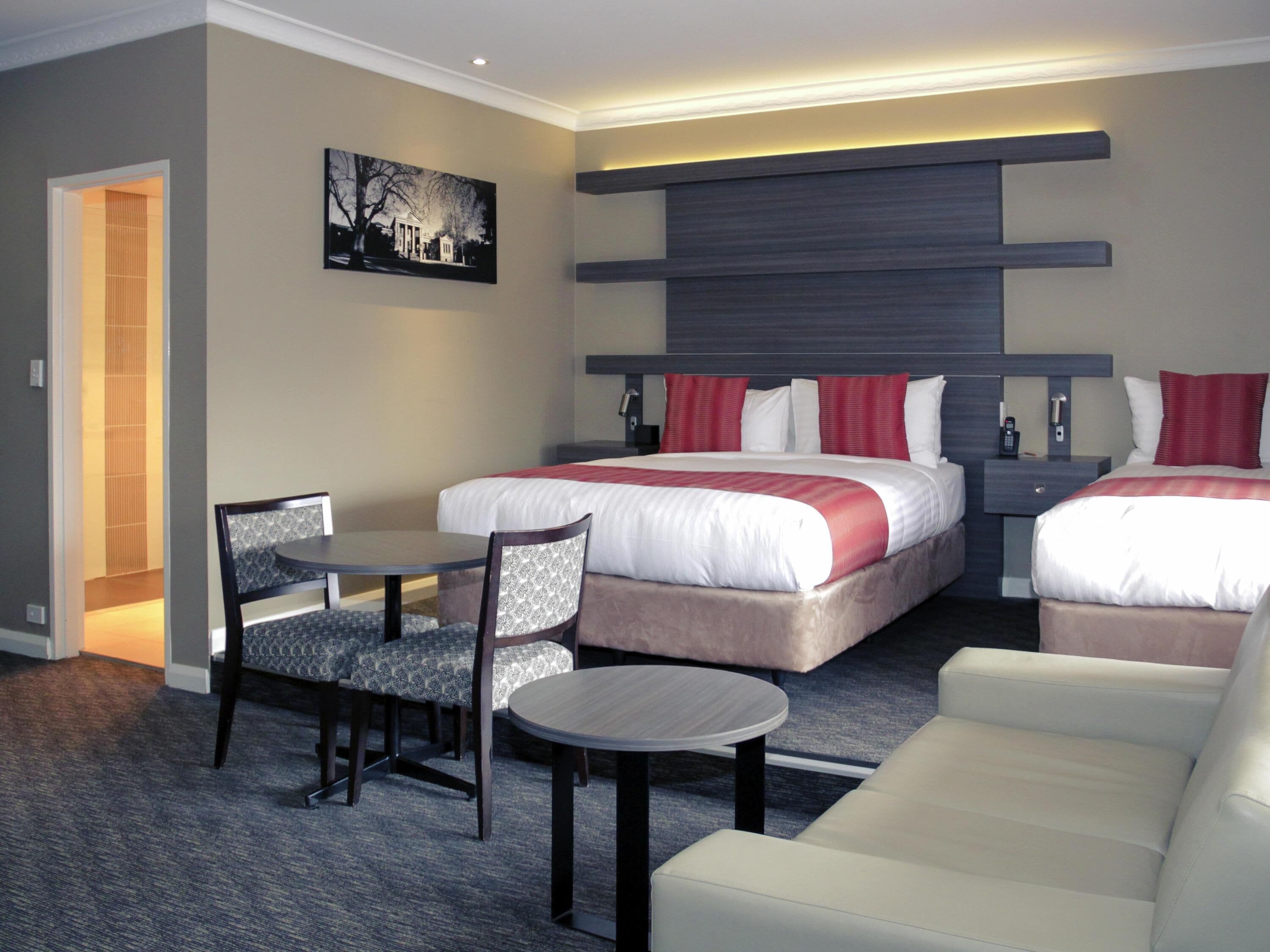 Deluxe Suite, Multiple Beds | Premium bedding, free minibar items, in-room safe