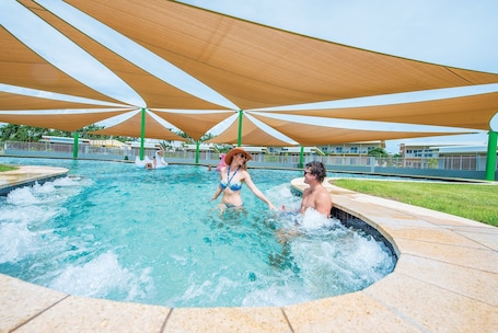 2 outdoor pools, open 7 AM to 9 PM, pool loungers. Club Tropical Resort Darwin