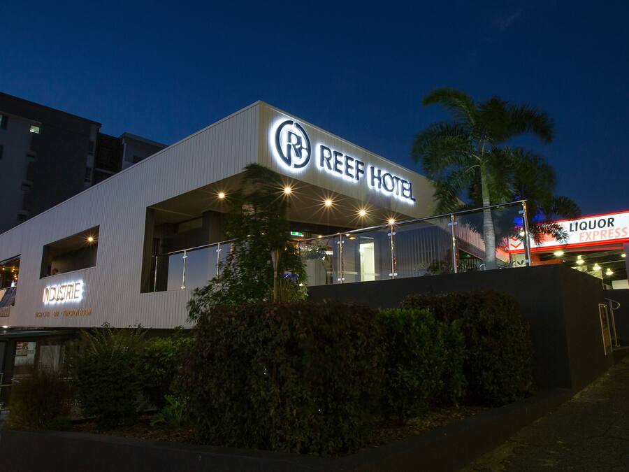 A modern hotel with a rooftop bar and a liquor express.