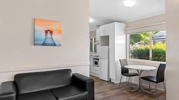 Superior 1 Bedroom Cabin | Living area | LCD TV