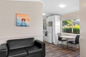 Superior 1 Bedroom Cabin | Living area | LCD TV