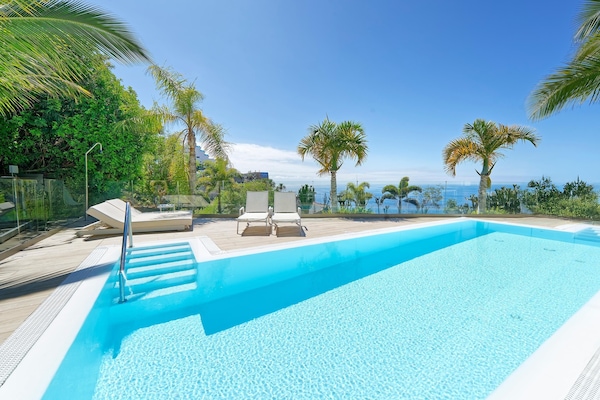 2 outdoor pools, open 11:00 AM to 6:00 PM, pool umbrellas, pool loungers