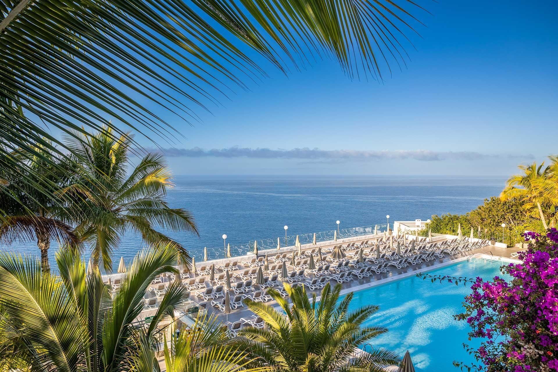 2 outdoor pools, open 11:00 AM to 6:00 PM, pool umbrellas, pool loungers