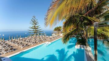 2 outdoor pools, pool umbrellas, pool loungers