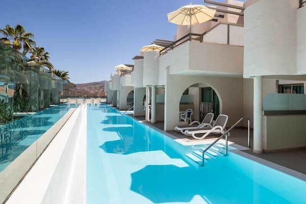 Outdoor pool, open 11:00 AM to 6:00 PM, pool umbrellas, pool loungers