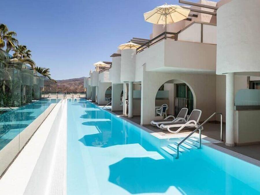 Outdoor pool, open 11:00 AM to 6:00 PM, pool umbrellas, sun loungers