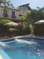 Outdoor pool, pool umbrellas, sun loungers