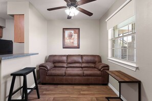 Suite, 1 Bedroom, Non Smoking | 1 bedroom, desk, laptop workspace, iron/ironing board