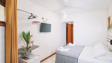 Economy Triple Room | Minibar, in-room safe, blackout drapes, free WiFi