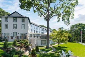 A large, white building with multiple windows and a central staircase. - The Pridwin Hotel (Shelter Island Heights)