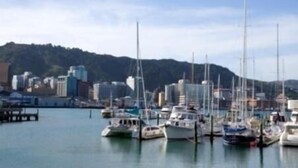 A marina with multiple sailboats docked. - Quest on Lambton (Wellington)