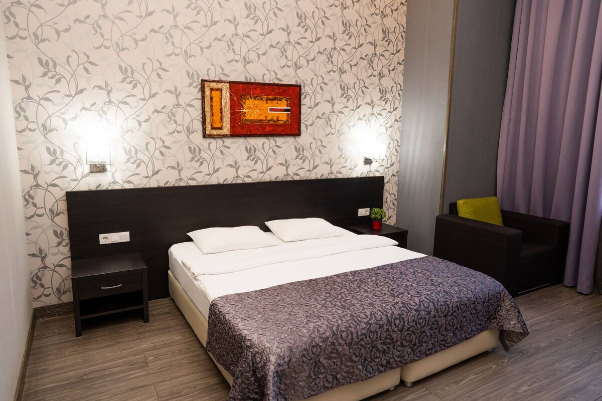 Standard Double Room | Living room | 42-inch plasma TV with digital channels, TV