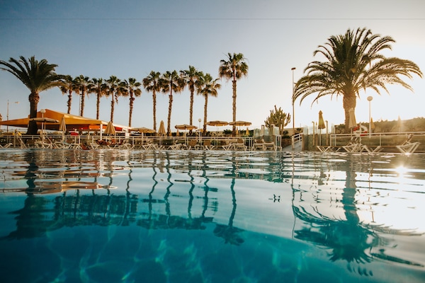 Outdoor pool, pool umbrellas, sun loungers