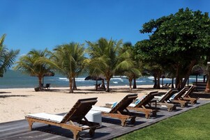 On the beach, sun loungers