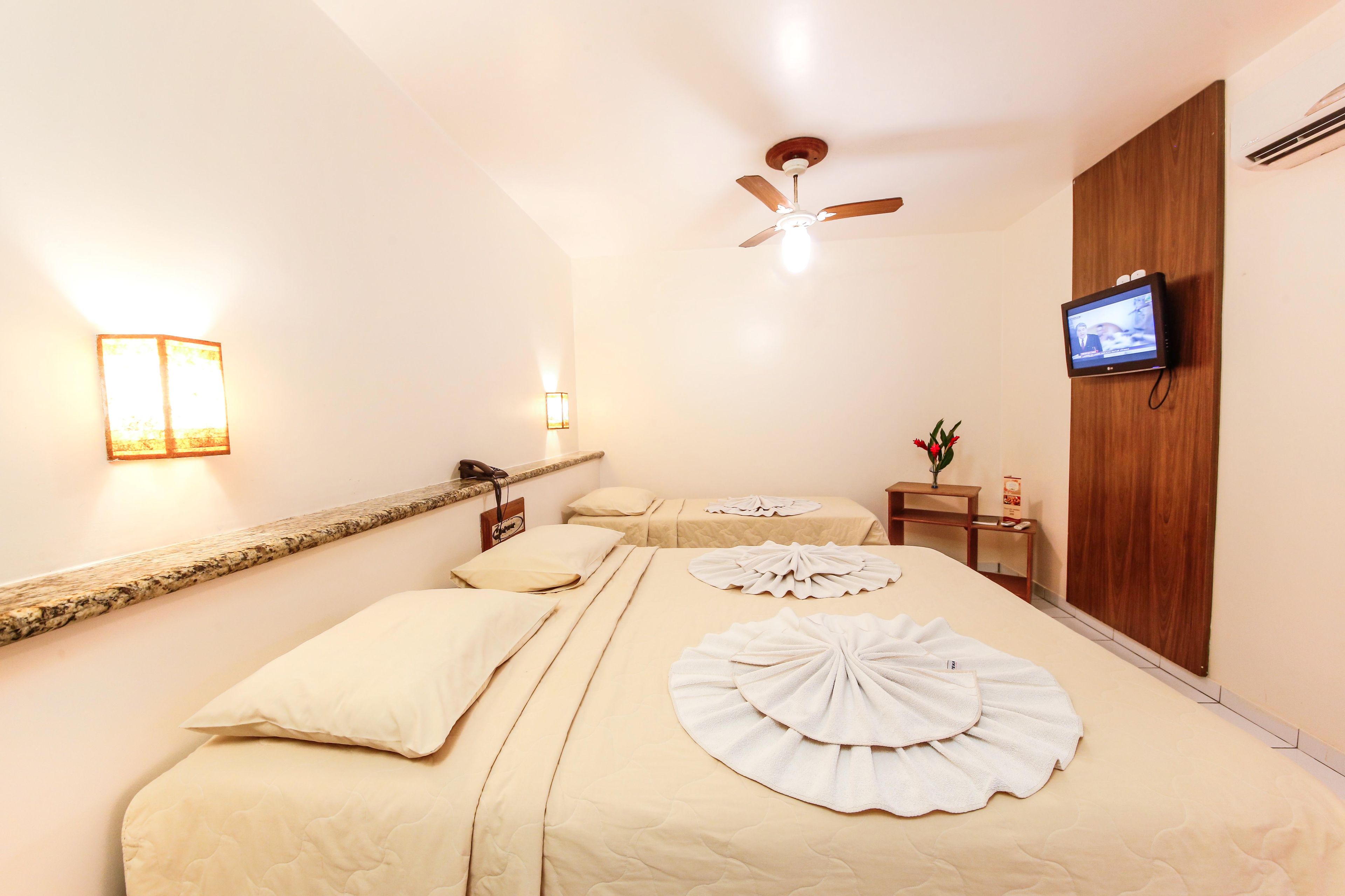 Quarto standard | Frigobar, roupa de cama