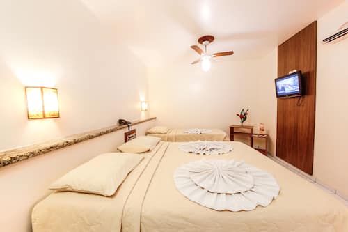 Quarto standard | Frigobar, roupa de cama