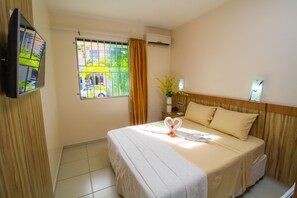 Quarto standard | Frigobar, roupa de cama